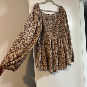 Tan and purple-ish colored long sleeve top with square neckline and stretch bust